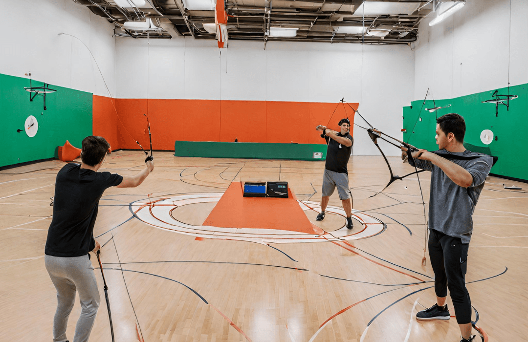 Players playing Archery at anytime courts in an indoor sports court